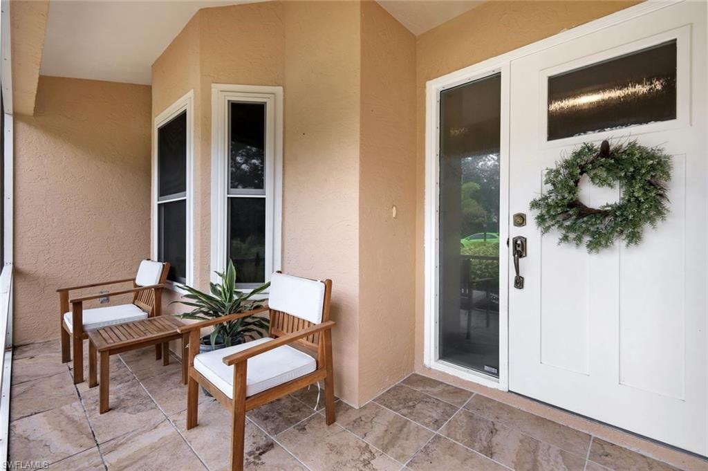 Elegant front entryway features an additional lanai.