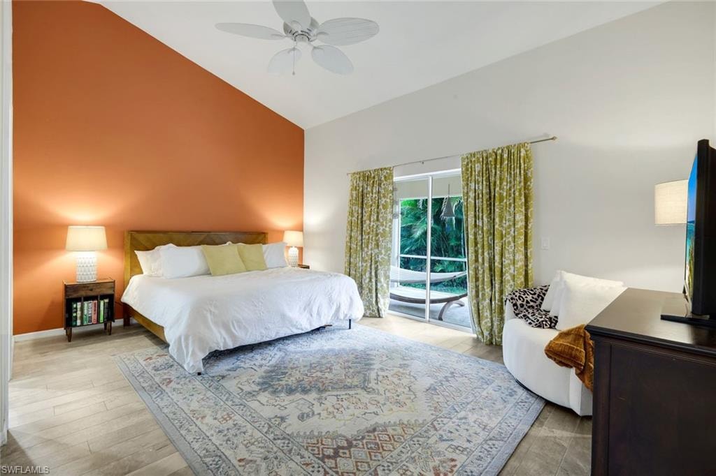 Spacious primary suite offers lanai access.