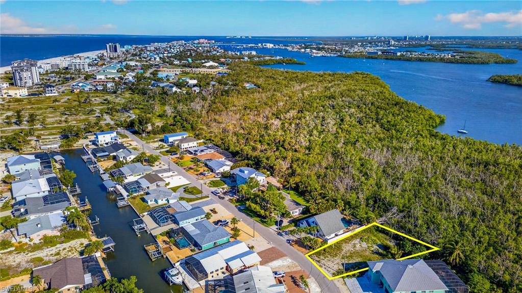 Coastal land parcel featuring mature vegetation and direct water access - Virtually Edited Image