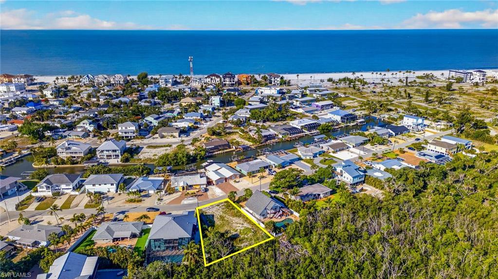 Cleared residential lot with mature trees bordering the property - Virtually Edited Image