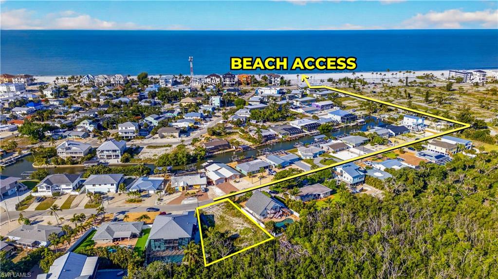 Aerial overview showcasing a coastal community with direct beach access - Virtually Edited Image