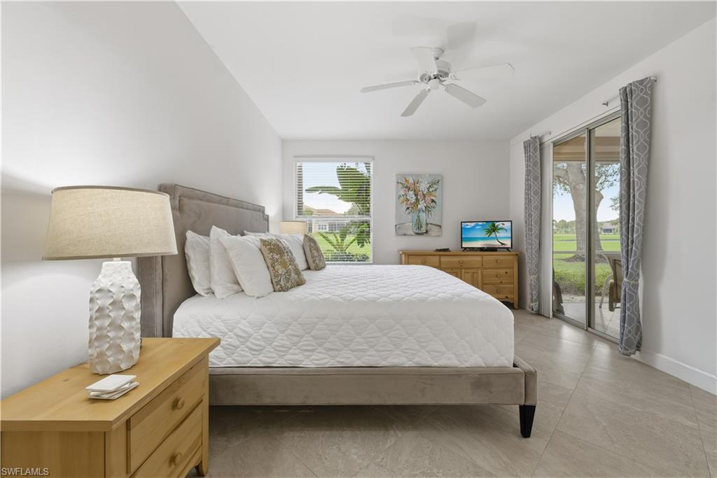 Bedroom featuring access to outside and ceiling fan