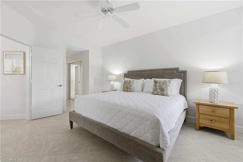 Bedroom featuring a ceiling fan and light tile patterned floors