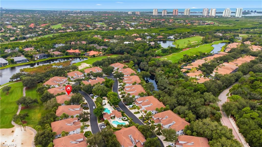 Aerial view of property's location with nearby suburban area