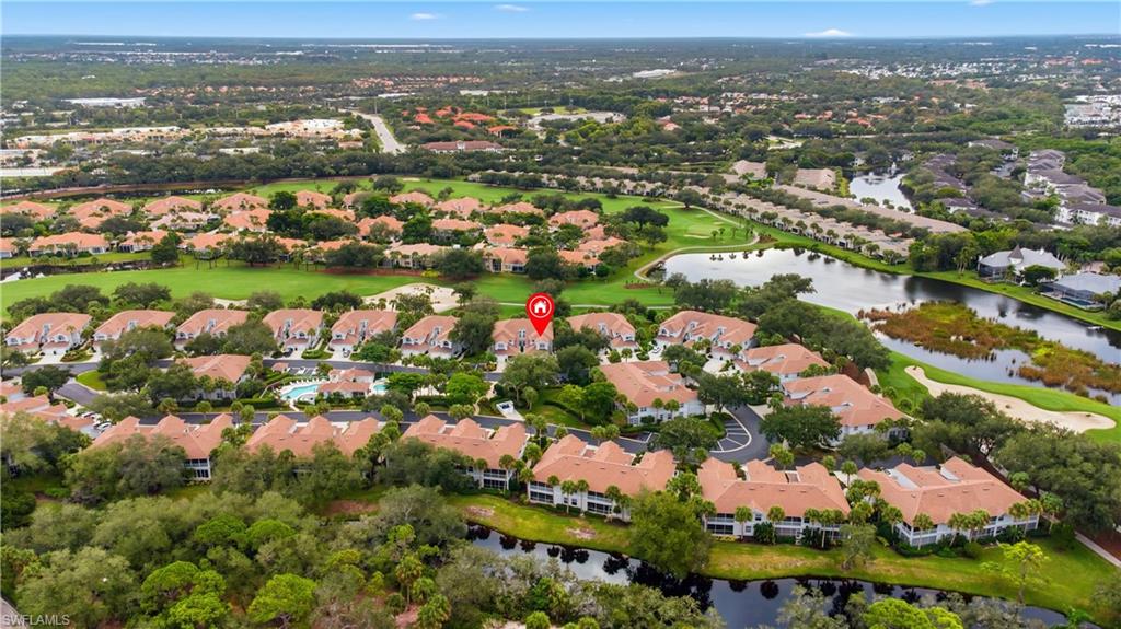 Aerial perspective of suburban area with a large body of water