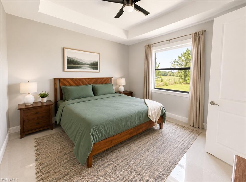 Master Bedroom Tray ceiling featuring a ceiling fan with light fixture