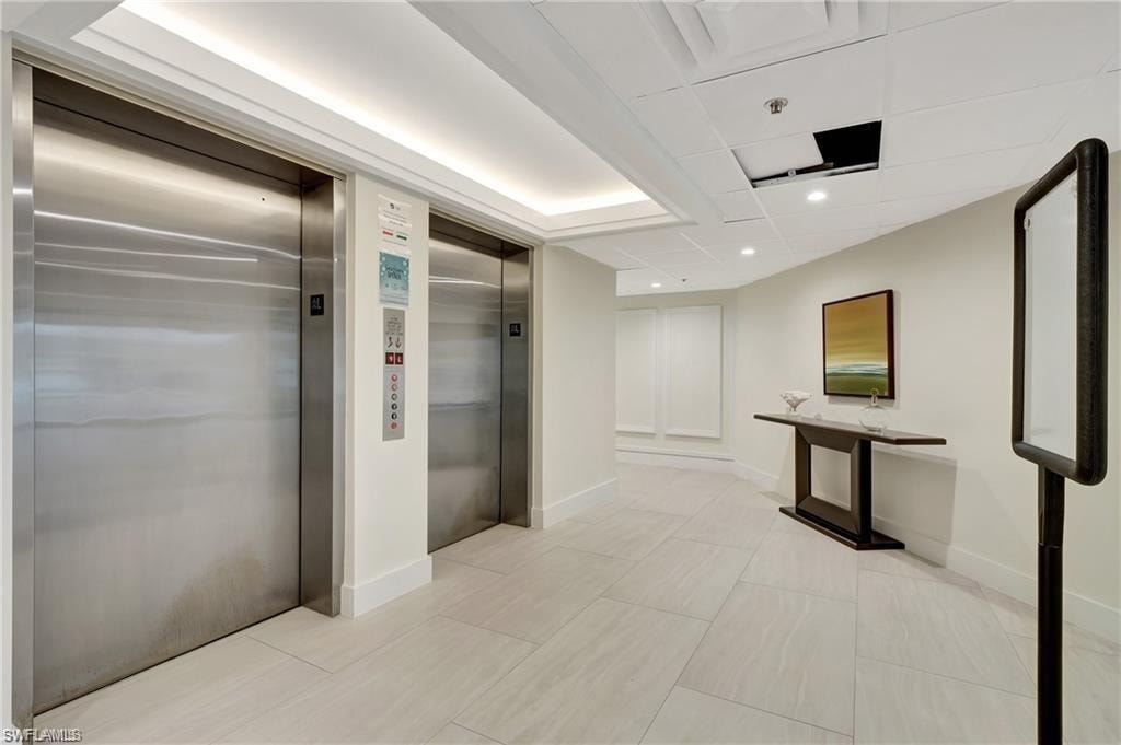 Lobby with elevators, storage rooms and access to the carport, boat dock and recreation facilities