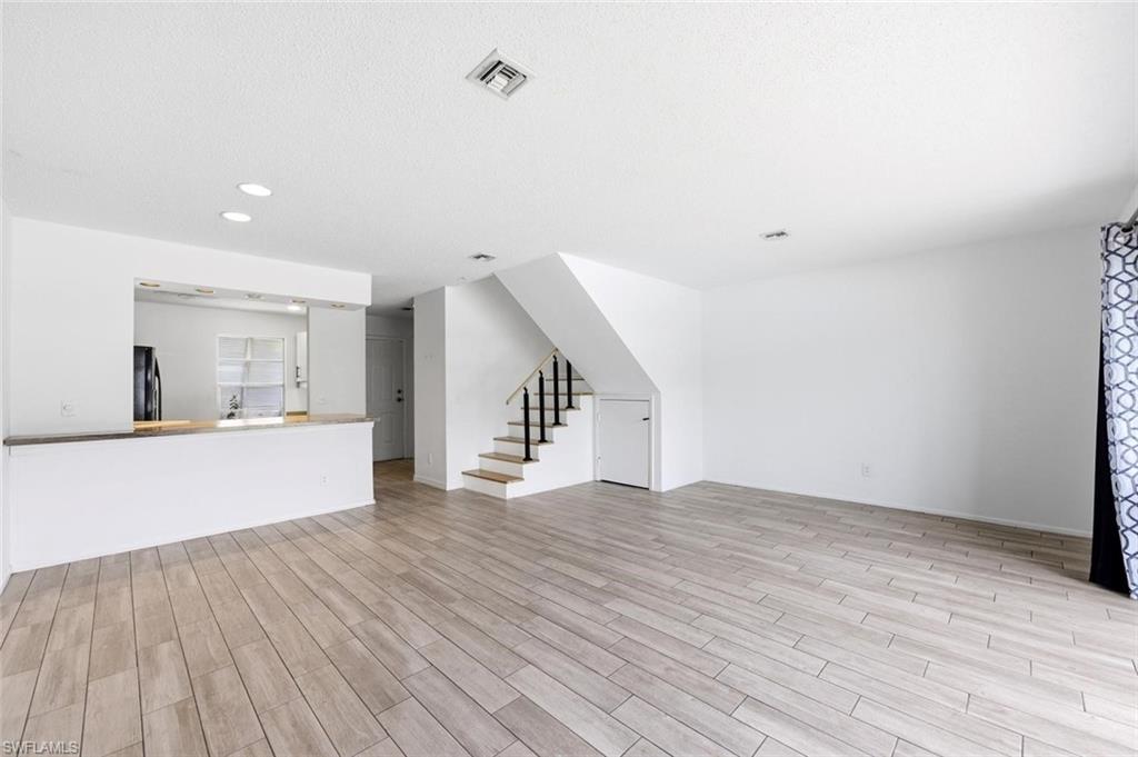 Stairs leading to two master bedrooms