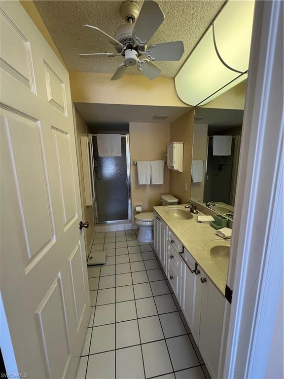 Bathroom featuring a double vanity with integrated sinks, white cabinetry, and a full-width mirror