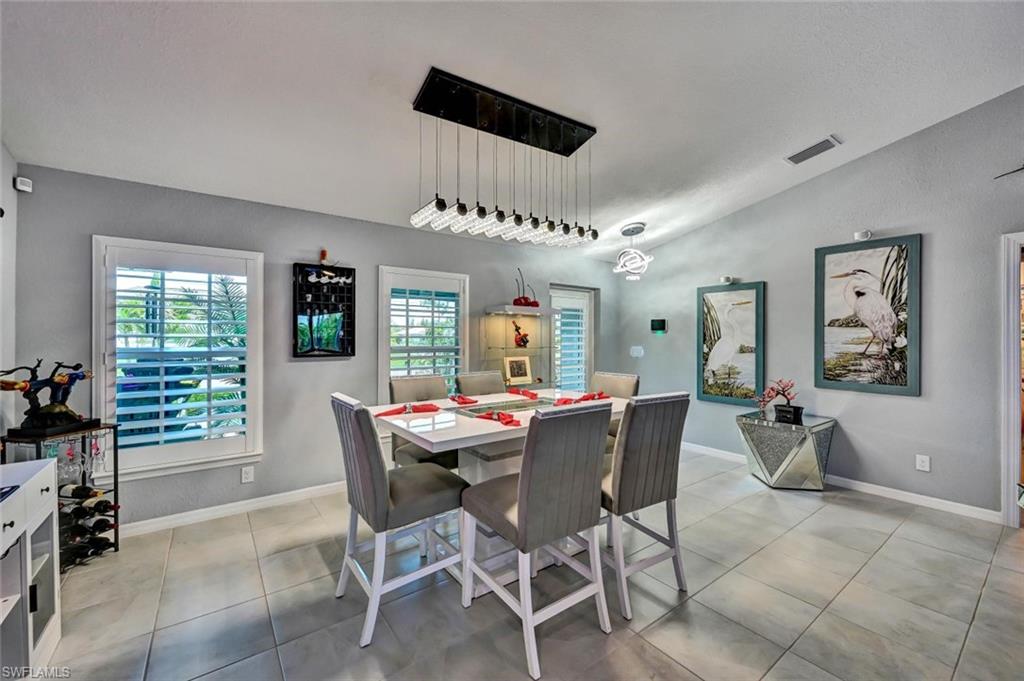 Formal dining area featuring tile flooring and neutral wall tones