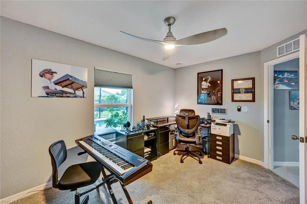 Room featuring light gray wall paint and matching gray carpeting