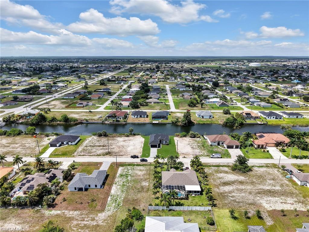 Aerial perspective showcasing a residential area with canal access