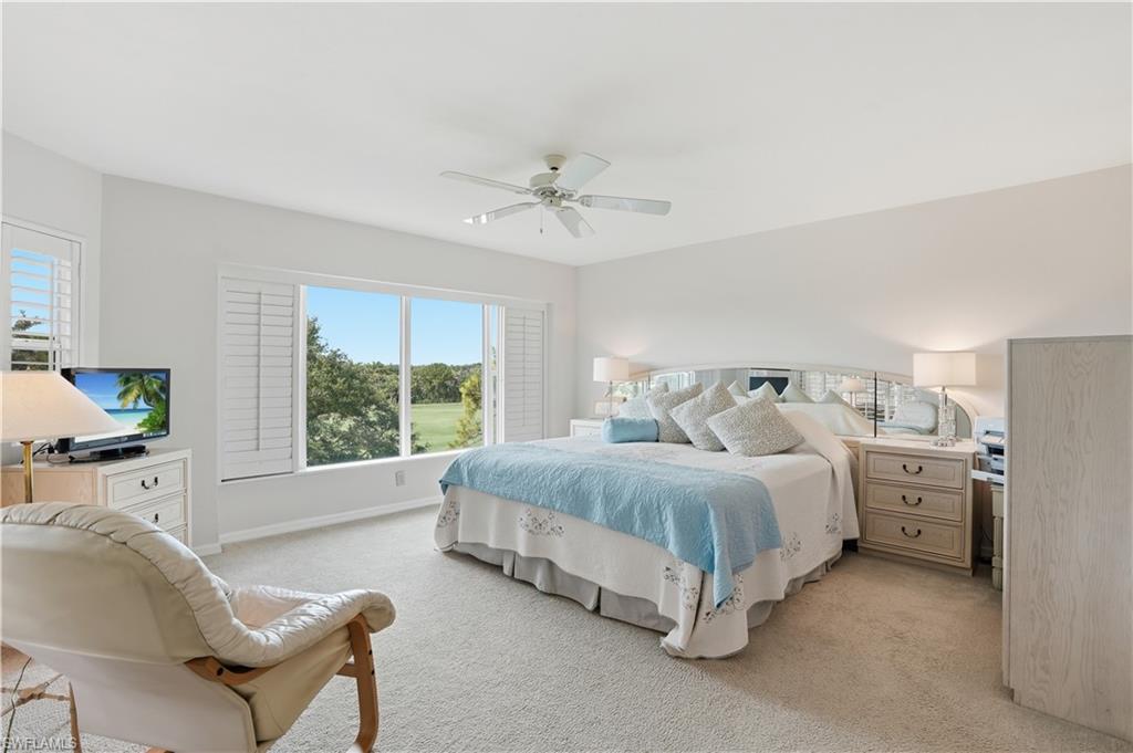 A tranquil primary suite overlooking the course - perfect for recharging after a day of Florida sunshine.