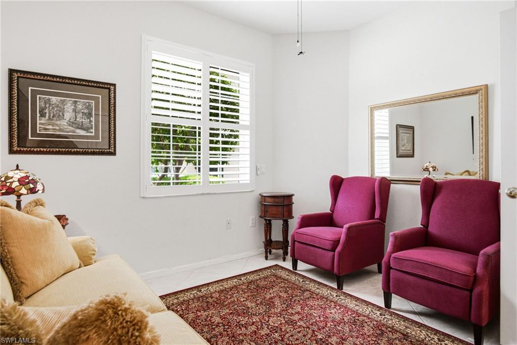 Guest Bedroom 1, currently set up as a sitting area. Boasting a large walk-in closet.