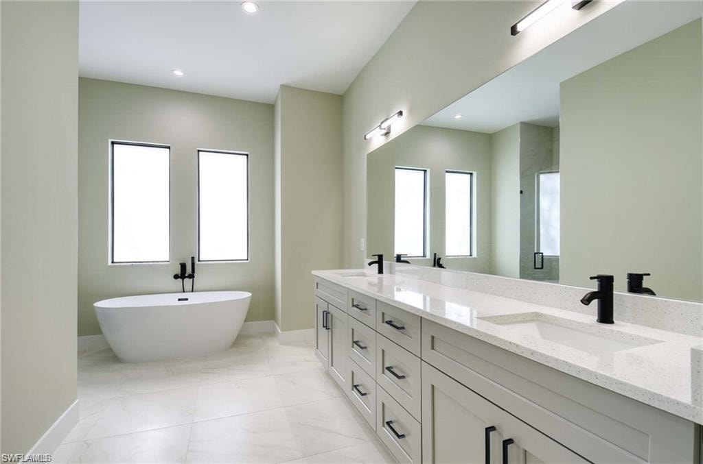 Master Bathroom wirh free-standing bathtub, custom cabinets and a huge shower