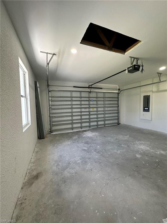 Garage featuring a garage door opener