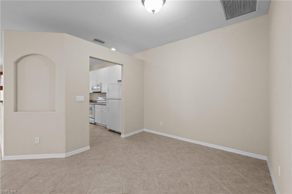 Dining Room featuring baseboards and light tile patterned floors