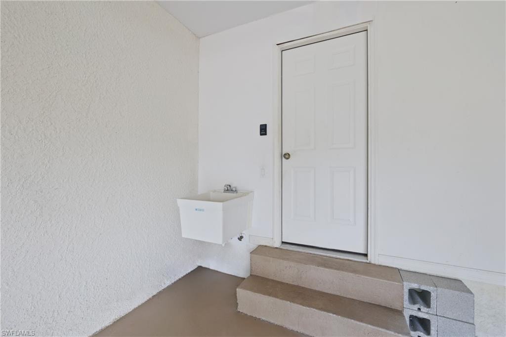 Garage with a laundry sink.  Garage Service Door