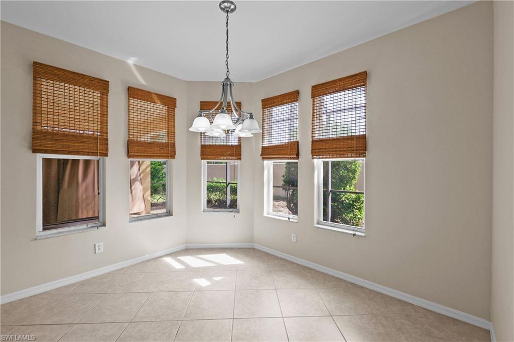Large Breakfast dining area featuring a chandelier and light tile patterned floors