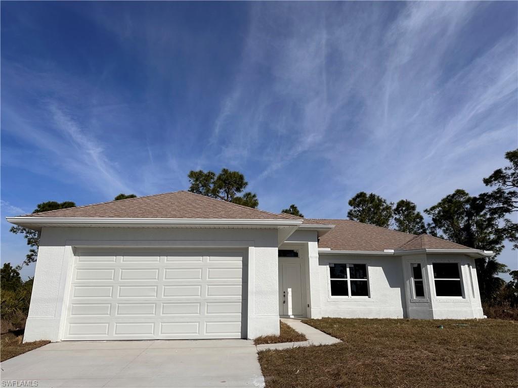 Ranch-style house featuring a garage