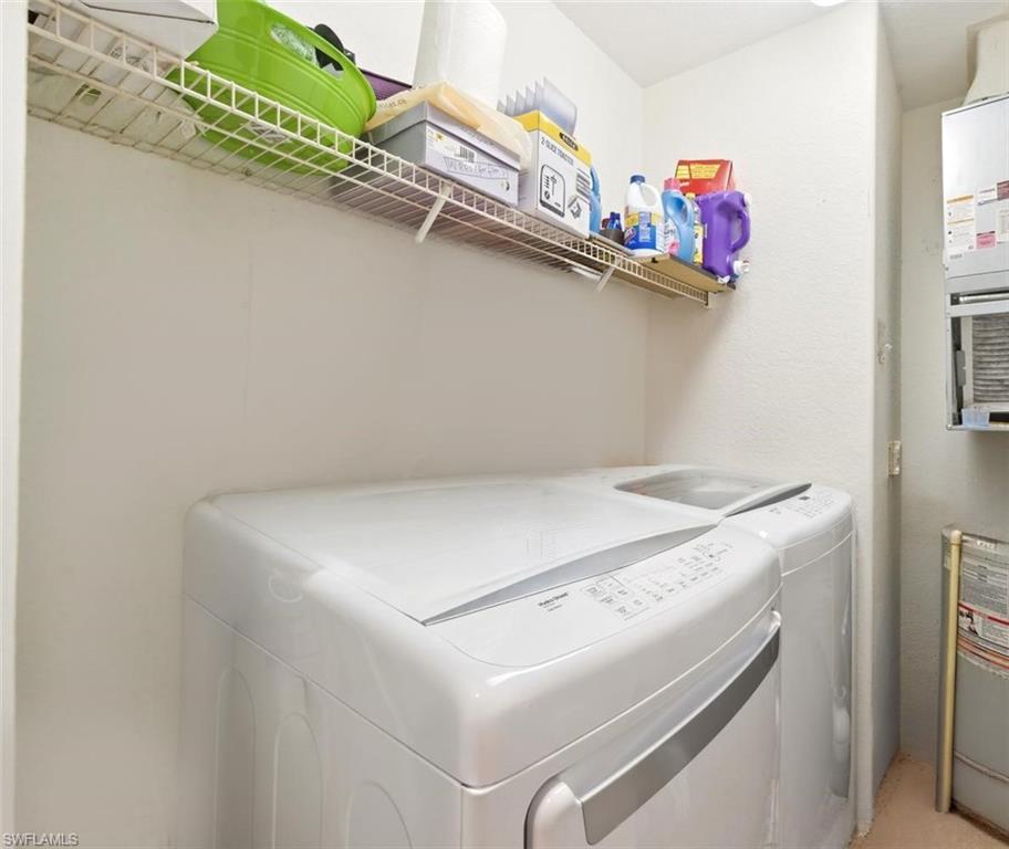 Laundry Room with side-by-side washer and Dryer.