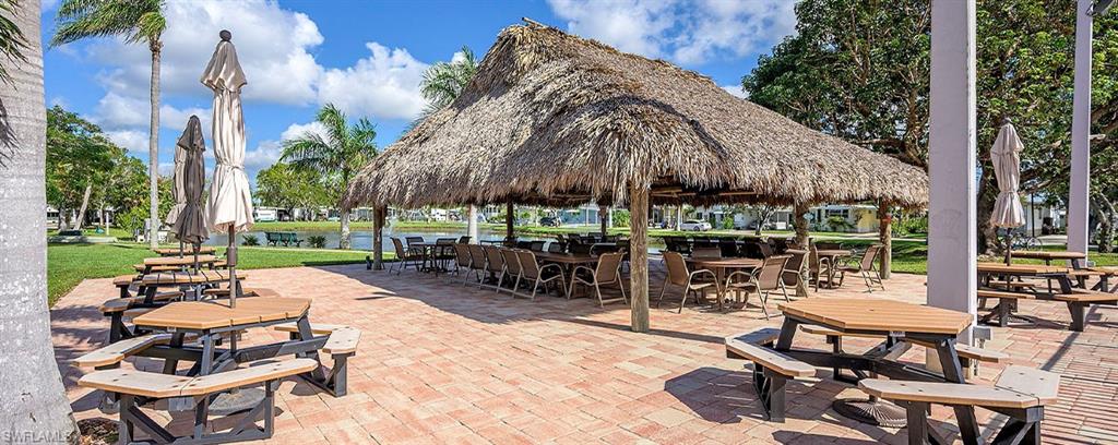 Tiki Hut seating and dining area with serene water lake view