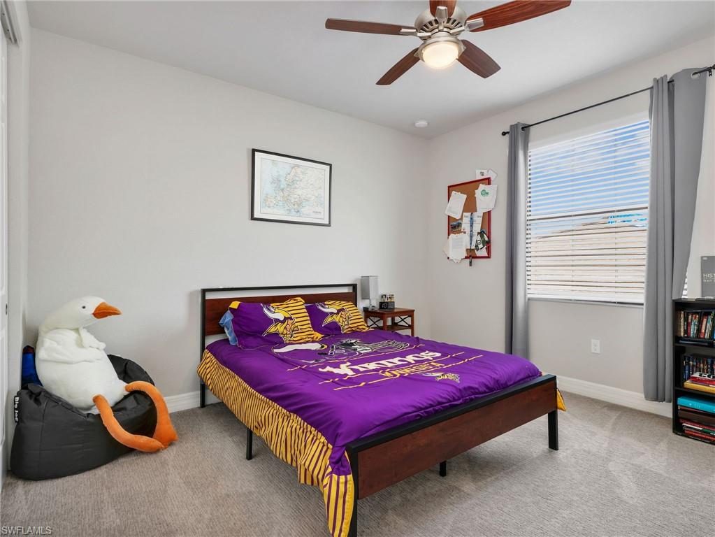 Neutral-toned walls and grey carpet flooring