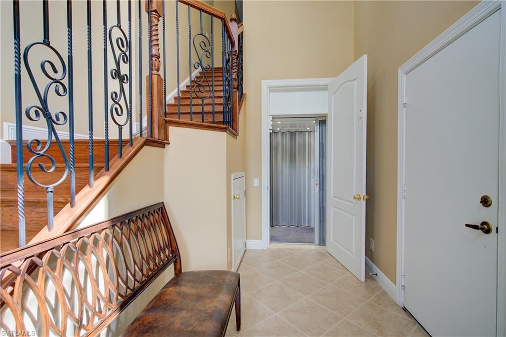 Entry with Elevator and beautiful staircase