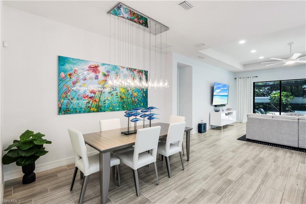 Dining area with custom lighting.