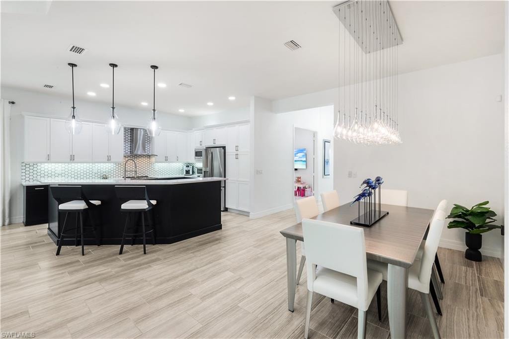 Great room facing kitchen and dining area.