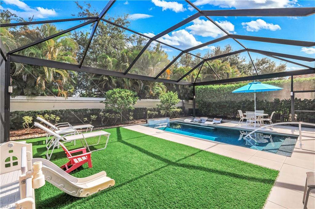 Turf lounge/play area, outdoor pool, sundeck and enclosed lanai.