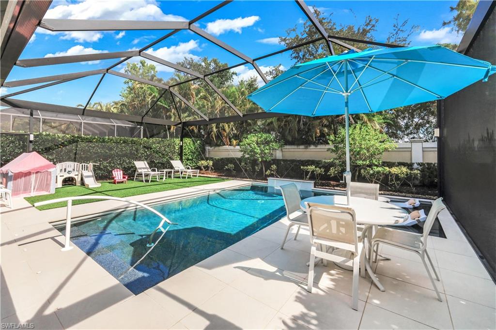 Fabulous lanai with under cover area, large pool, lounge area, electric hurricane screens and built-in kitchen (not shown).