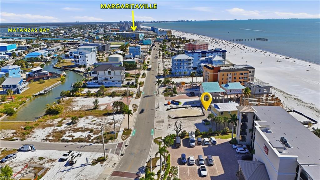 Aerial view of property and surrounding area featuring a large body of water - Virtually Edited Image