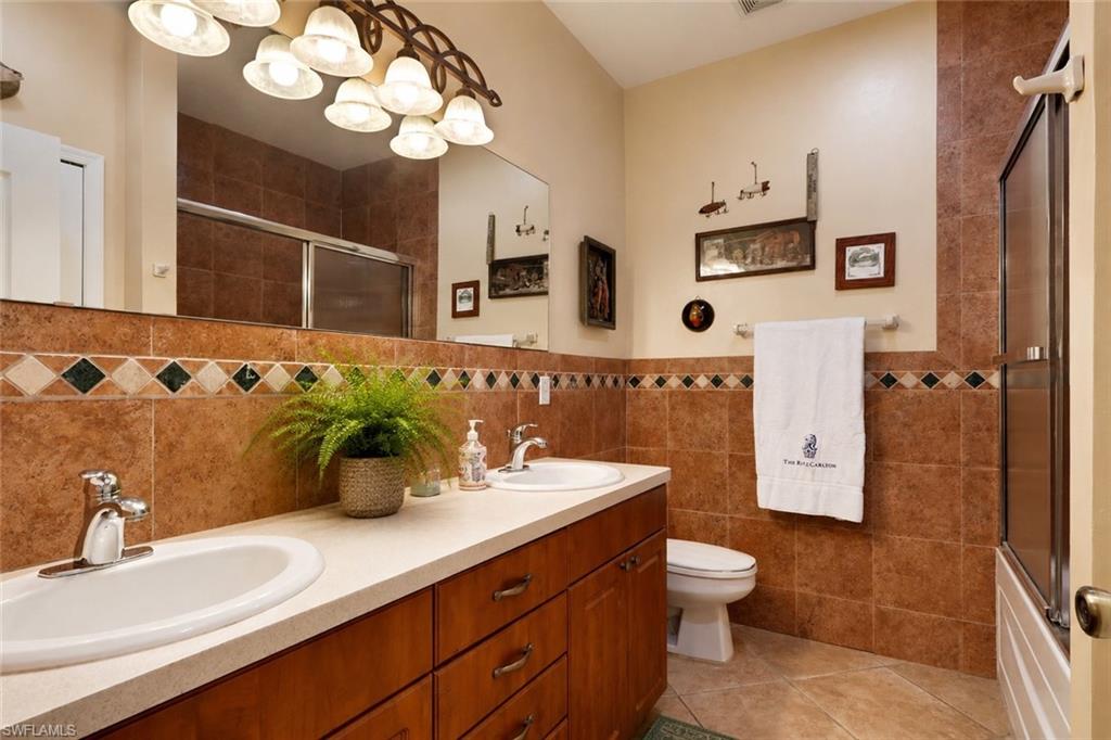Double vanity with integrated sinks and a light-colored countertop