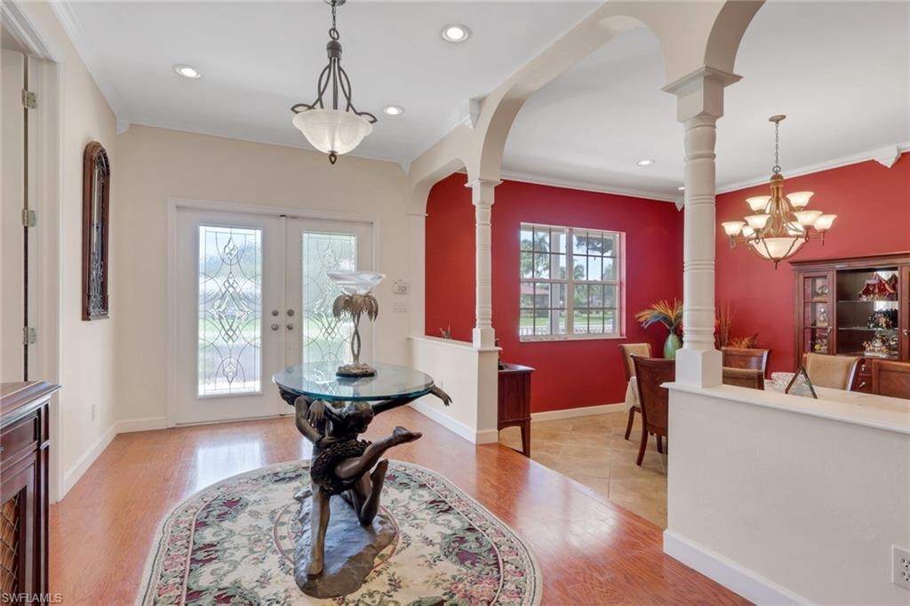Entryway featuring double doors with decorative glass panels