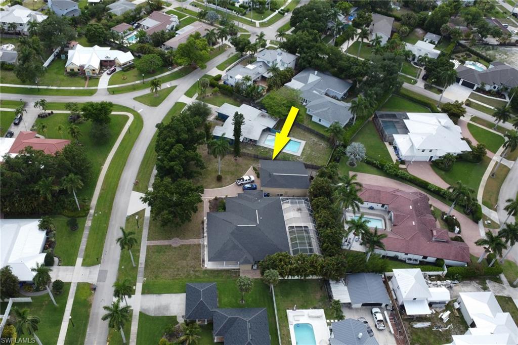 Aerial perspective highlighting a property with a private pool