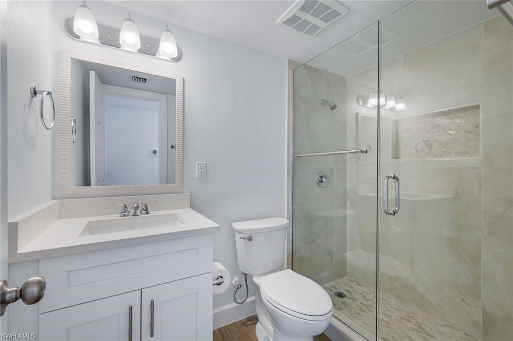 Guest bathroom offers walk-in shower.