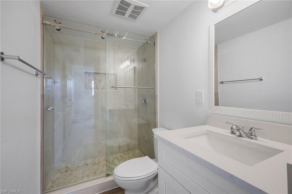Ensuite primary bathroom features a walk-in shower.