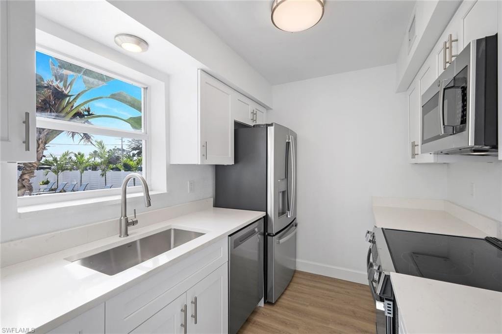 Enjoy pool views while preparing your favorite meal.