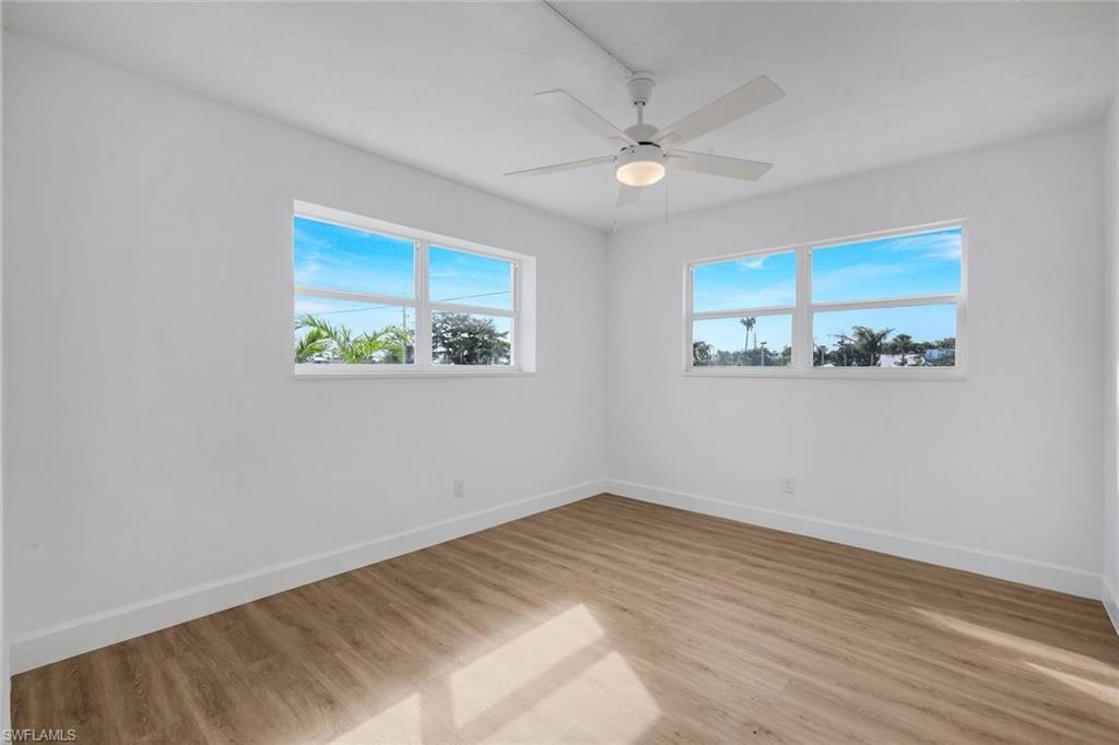 Guest bedroom with features an abundance of natural light.