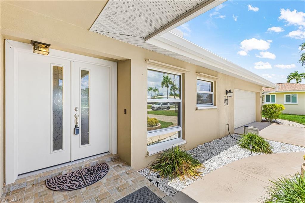 Double door entry with paver , covered front entry