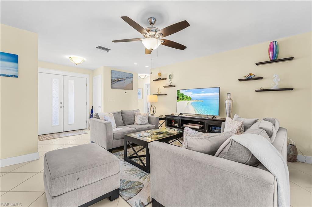 Spacious great room open to kitchen and patio and pool