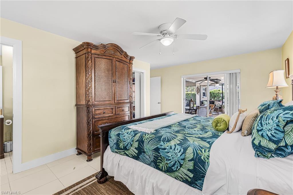 Primary bedroom with sliders to the pool, walk in closet and bath with walk in shower