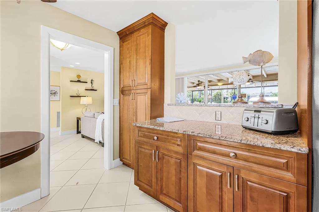 Beautiful wood cabinets and tile flooring