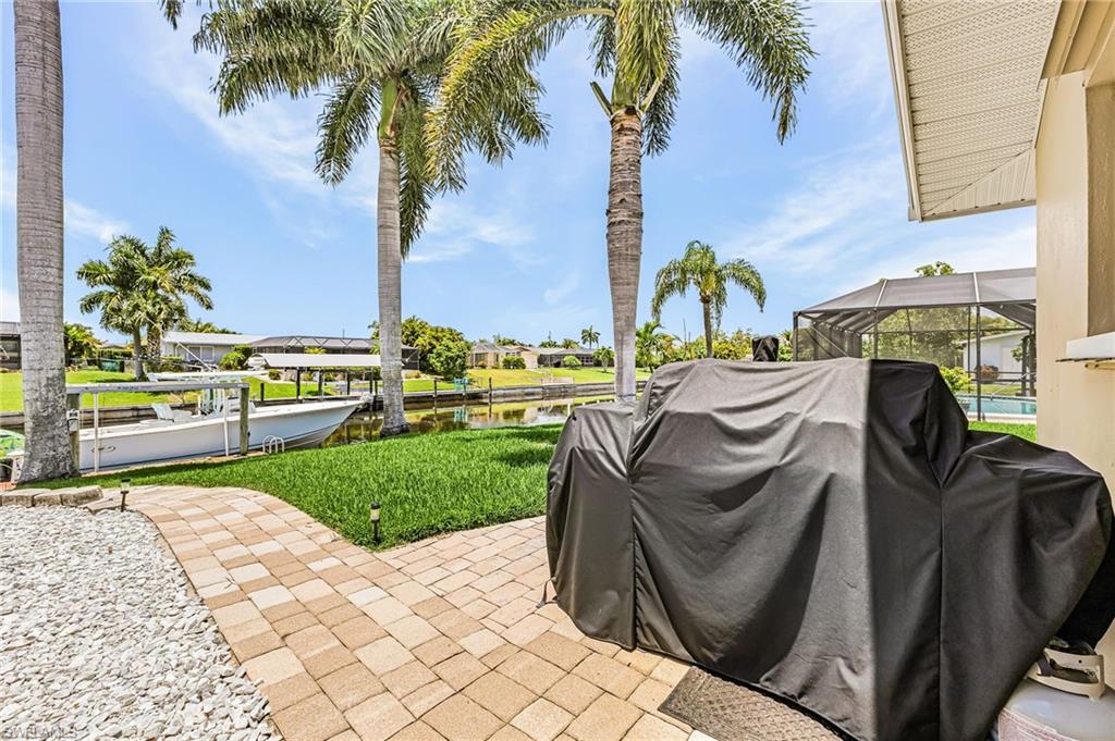 Outdoor patio for grilling and walkway to the dock.