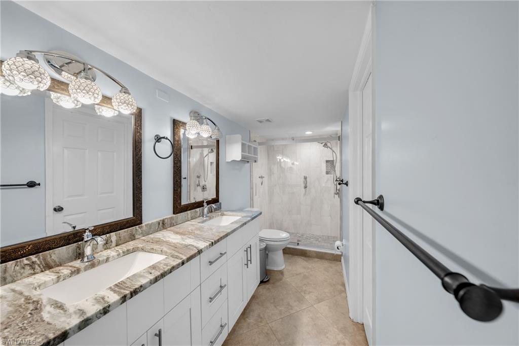 Double vanity with integrated sinks and a stone countertop
