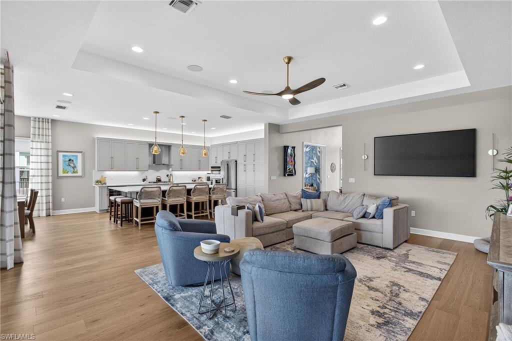 Open-concept living space featuring wood-finish flooring