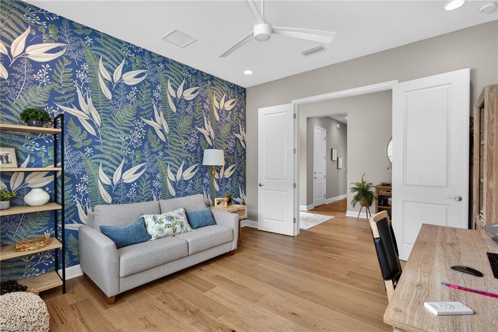 Accent wall featuring botanical-patterned wallpaper
