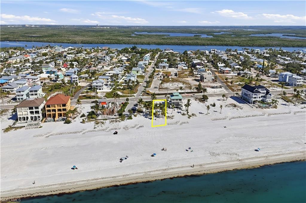 Aerial perspective of suburban area featuring a large body of water - Virtually Edited Image