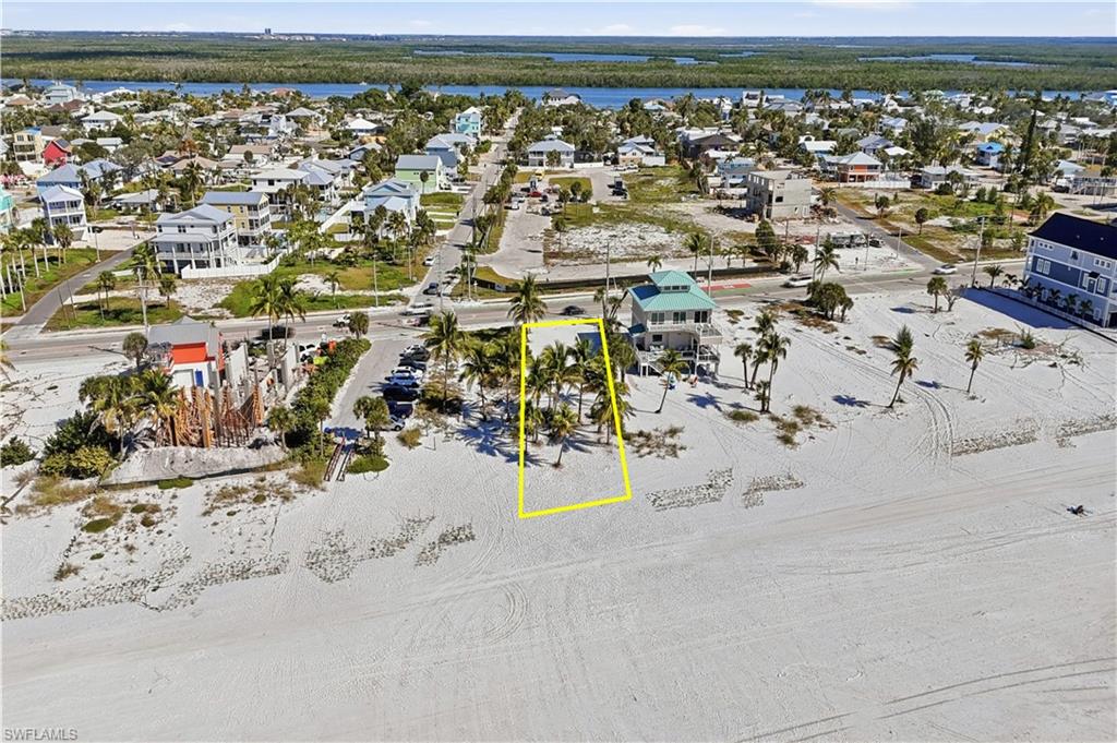 Aerial view of residential area featuring a nearby body of water - Virtually Edited Image